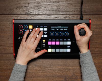 Canon RC-SK5 controller being used with its joystick and preset buttons