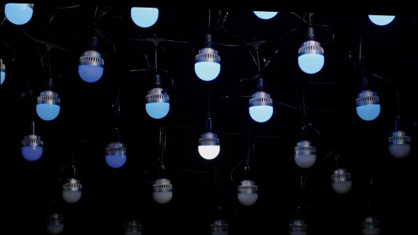 NanLite PavoBulb 10C hanging from ceiling with multiple color nuances